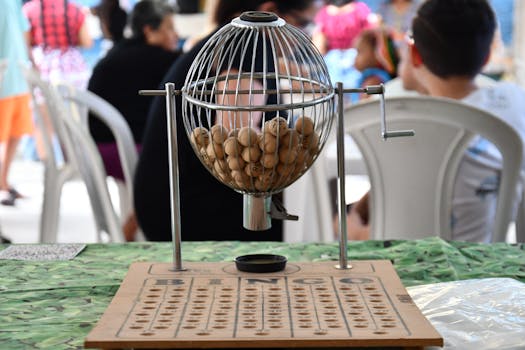 A small machine with balls in it on a table